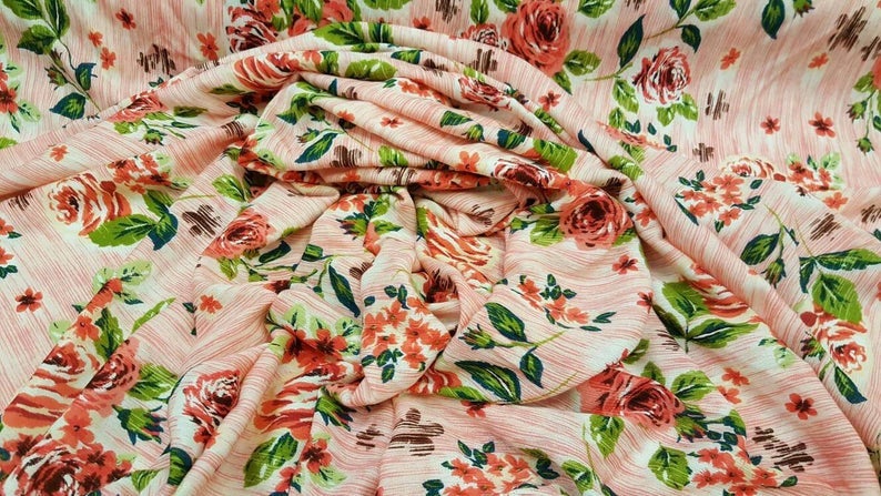 Rayon crepon textured floral flowers Coral and green on pink background organic fabric sold by the yard soft organic kids dress draping